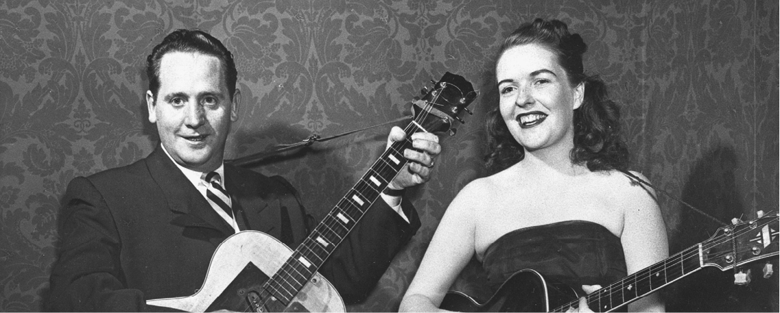FILE - In this Nov. 5, 1951 file photo, Les Paul and his wife, Mary Ford, perform with their guitars. Paul, 94, the guitarist and inventor who changed the course of music with the electric guitar and multitrack recording and had a string of hits, died, Thursday, Aug. 13, 2009 in White Plains, N.Y., according to Gibson Guitar. (AP Photo, file)