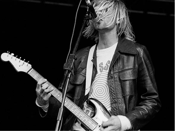 Nirvana play the main stage at Reading Festival 23rd Aug 1991. The band played midway down the bill in the afternoon. After the success of their breakthrough seminal album Nevermind released in October 1991 the band went onto the headline the main stage in 1992. Pictured lead singer and rock icon Kurt Cobain.